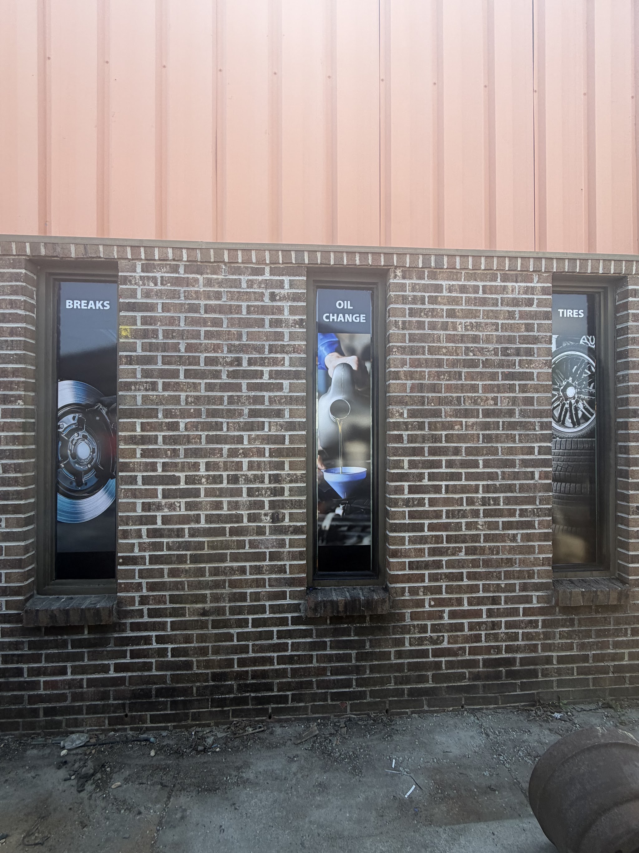 JR AUTO CARE storefront on Piedmont Ave with brakes, oil change and tires window signs