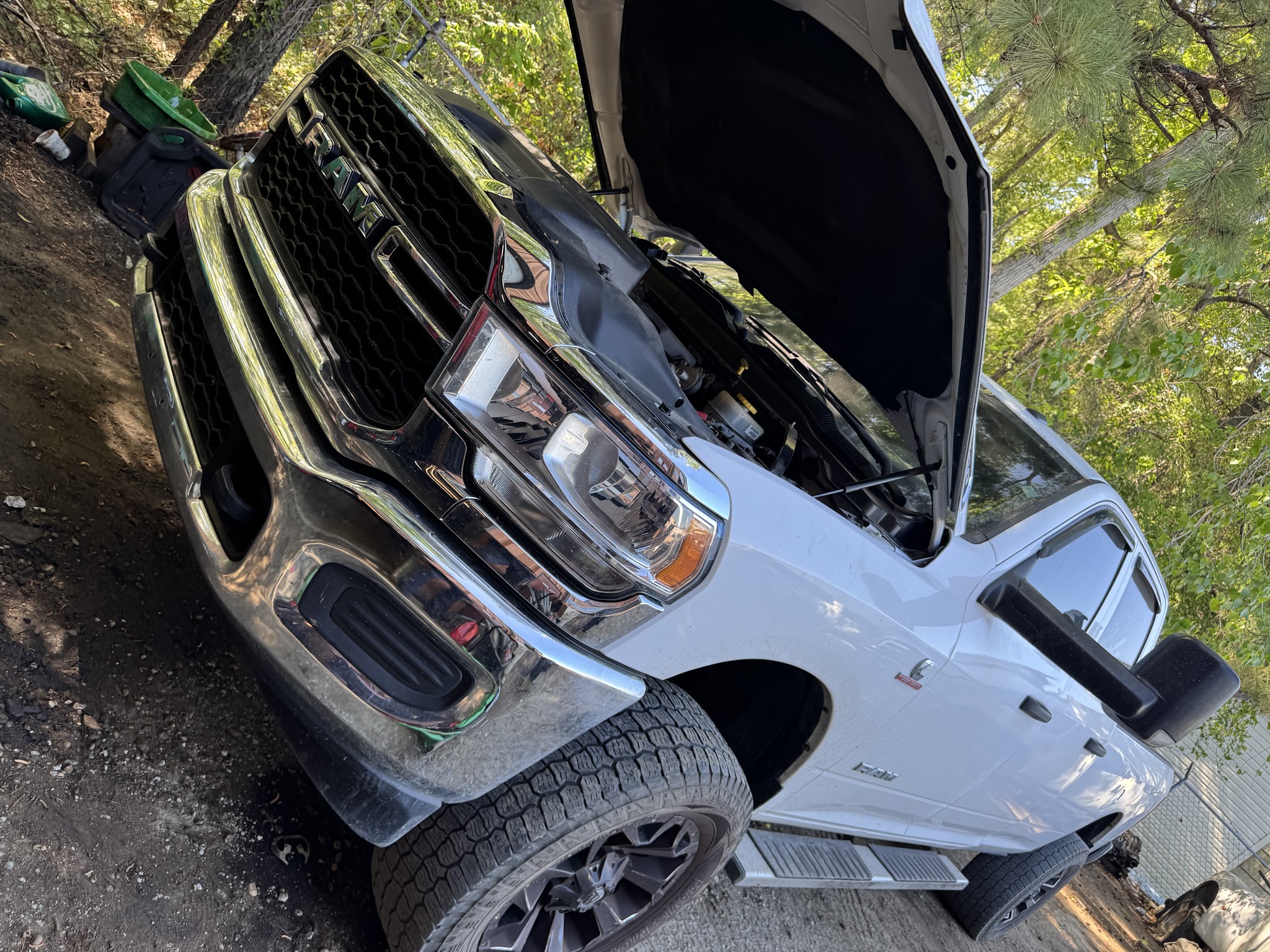 A pickup truck with the hood up